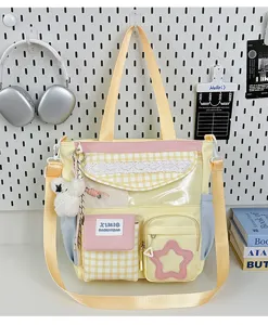 Cute Japanese style candy color canvas shoulder bag with clear front pocket and plush bear pendant.
