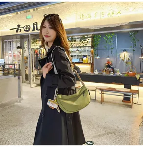 Detailed shot of the Japanese casual crescent shoulder bag in olive green, stylish canvas design.