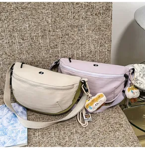 Japanese style candy color casual crescent chest bag and crossbody bag with cute plush charm.