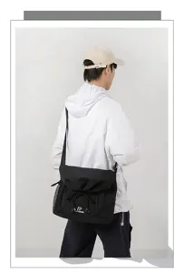 Casual black messenger bag detail view, large capacity daily commute shoulder bag for men