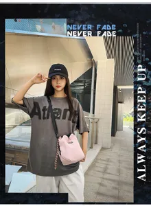 Casual lightweight nylon candy color neutral drawstring bucket bag for daily travel.