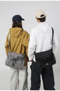 Detail view of large capacity canvas crossbody messenger bag with mesh side pockets for daily.