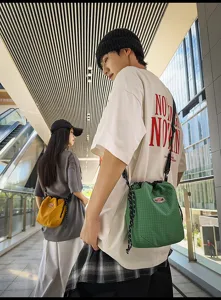 Detail view of the casual nylon drawstring bucket bag, lightweight and stylish for daily use.
