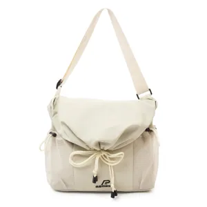 Utility messenger bag detail view, casual crossbody bag with drawstring and mesh pockets.