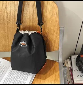Casual nylon drawstring bucket bag, lightweight unisex travel hiking shoulder crossbody bag.