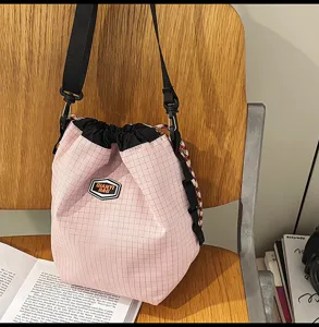 Pink plaid nylon drawstring bucket bag casual daily shoulder crossbody bag for travel.