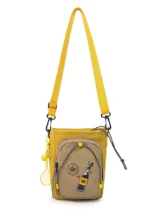 Bolso bandolera informal de moda para teléfono color caramelo con colgante de tenis.