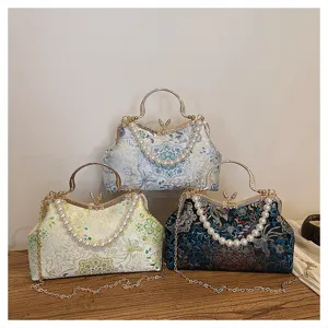 Sac de soirée vintage brodé avec fermoir, poignée en perles et chaîne pour femmes élégantes.
