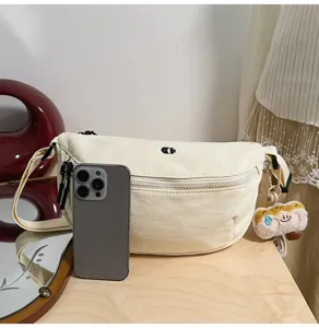 Casual canvas crescent shoulder bag, stylish versatile crossbody chest bag for women daily.