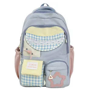 Detailed view of the multi-pocket pastel backpack showcasing cute plaid and star design.