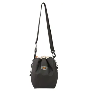 Detailed view of the black nylon drawstring bucket bag, highlighting texture and strap design.
