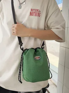 Casual green grid nylon drawstring bucket bag, lightweight crossbody travel shoulder bag for daily use.
