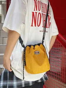 Casual lightweight nylon drawstring bucket bag, unisex candy color travel shoulder crossbody bag.