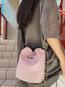 Casual nylon pink grid drawstring bucket bag crossbody bag for daily travel and hiking.