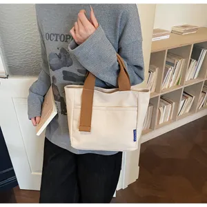 Borsa tote in tela casual minimalista da donna, elegante borsetta quotidiana con manici marroni.