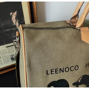Casual canvas reistas met bruine lederen afwerking, grote capaciteit sport weekender tas.