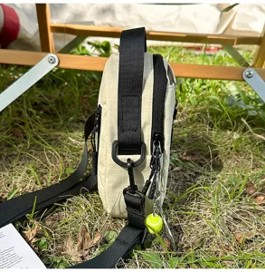 Minimalist grid mini crossbody bag for outdoor commuting, stylish phone and headphone pouch.