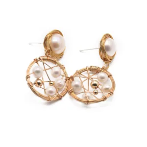 Elegant pearl earrings with handmade wire-wrapped geometric design and 925 silver pins.