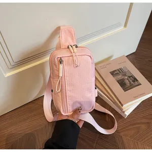 Pink plaid chest bag for women, casual grid sling bag with zipper pockets and strap.