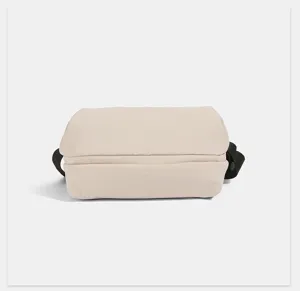 Minimalist beige nylon crossbody bag detail view, casual lightweight daily shoulder handbag.