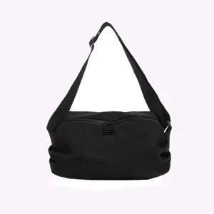 Black nylon crossbody bag detail, casual shoulder bag with smooth zipper closure.