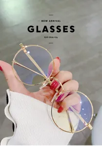 Gafas redondas de metal anti-luz azul con monturas doradas vintage para uso diario.