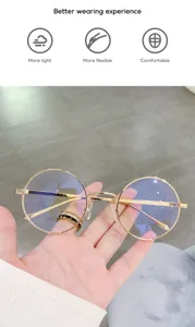 Detalles de las gafas redondas de metal anti luz azul con montura dorada y lentes claras.