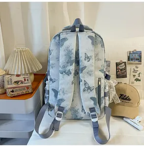 Detailansicht des blauen Schmetterling-Schülerrucksacks, große Kapazität für Schultasche.