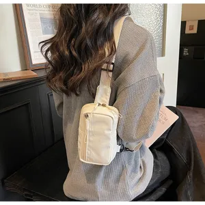 Minimalist canvas sling bag for women, stylish crossbody chest bag for daily travel and sports use.