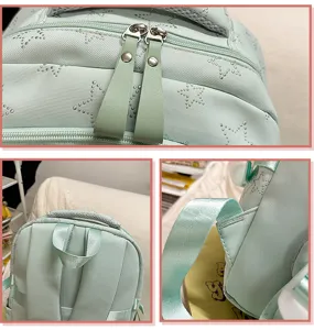 Detailed view of light green student backpack with star patterns, durable zippers and straps.