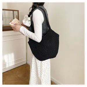 Schwarze gestrickte Damen Schultertasche mit Lochmuster, lässige Häkel Handtasche für den Alltag.