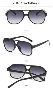 Détails rapprochés des lunettes de soleil rétro tendance à double pont et verres gris.