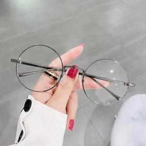 Montura de gafas redonda de metal estilo japones con filtro luz azul para estudiantes.