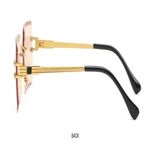 Modische damen sonnenbrille rahmenlos mit kristallgeschnittenen gläsern gold seilbügel.