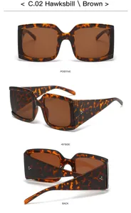 Occhiali da sole quadrati oversize chic con montatura tartarugata e lenti marroni.