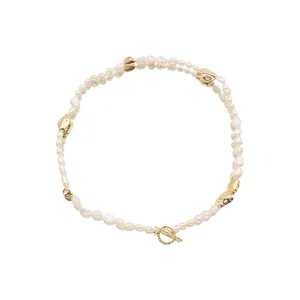 Elegant freshwater pearl necklace with gold beads and toggle clasp for daily chic look.