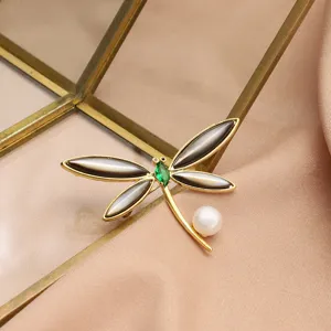 Elegant 18K gold plated pearl dragonfly brooch with green zircon and black shell.