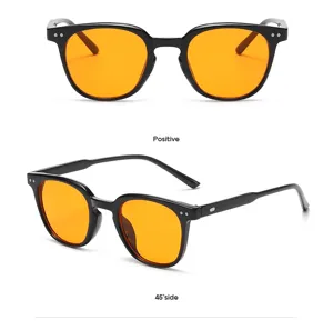 Ronde blauwlichtfilter bril met zwarte montuur en oranje lenzen modieuze casual stijl.
