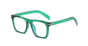 Transparent green square blue light blocking glasses with stylish metal hinge decor for daily use.