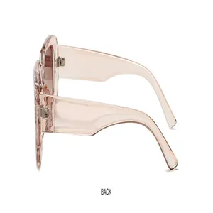Pink transparent thick frame square sunglasses side detail view, stylish eyewear accessory.