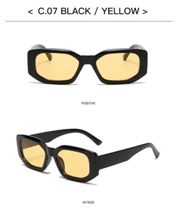 Detailed view of stylish square sunglasses with black frames and yellow lenses for a chic street look.