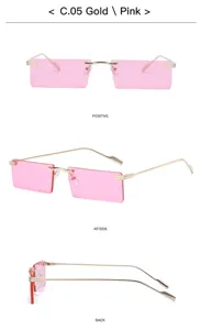 Detail view of trendy rimless rectangular sunglasses featuring chic gold frame and pink lenses.