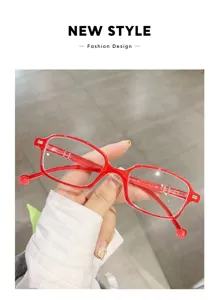 Detailed close-up of stylish red frame reading glasses, showcasing modern design and lightweight.