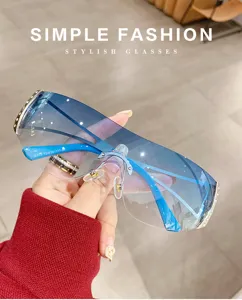 Close-up detail of Y2K gradient shield sunglasses with futuristic blue rimless lenses.