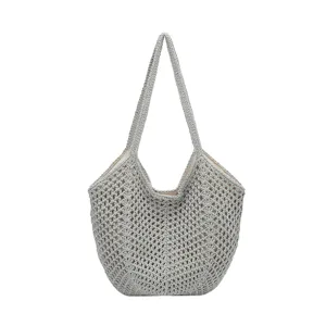 Graue Strick hohle Tote Tasche Detail, Häkel Schultertasche Textur und Innenfutter Design.