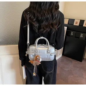Chic silver PU crossbody bag for women, trendy metallic shoulder handbag with cute charm.