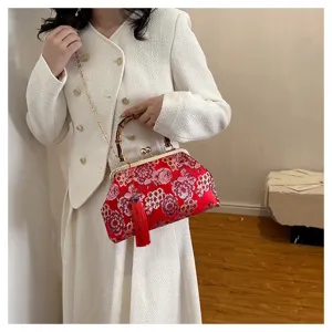 Schicke chinesische bestickte Brokat Abendtasche mit Bambusgriff und roter Quaste.