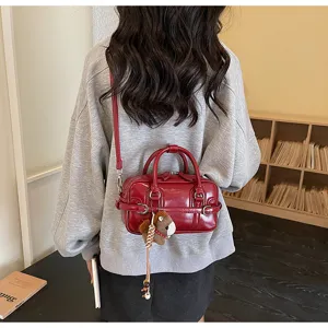 Women's glossy PU leather crossbody bag, stylish red shoulder bag with cute horse charm.