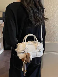 Chic white PU leather shoulder crossbody bag with cute horse charm for women daily fashion.