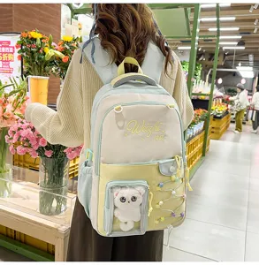 Pastel colorblock school backpack with transparent front pocket and cute plush toy